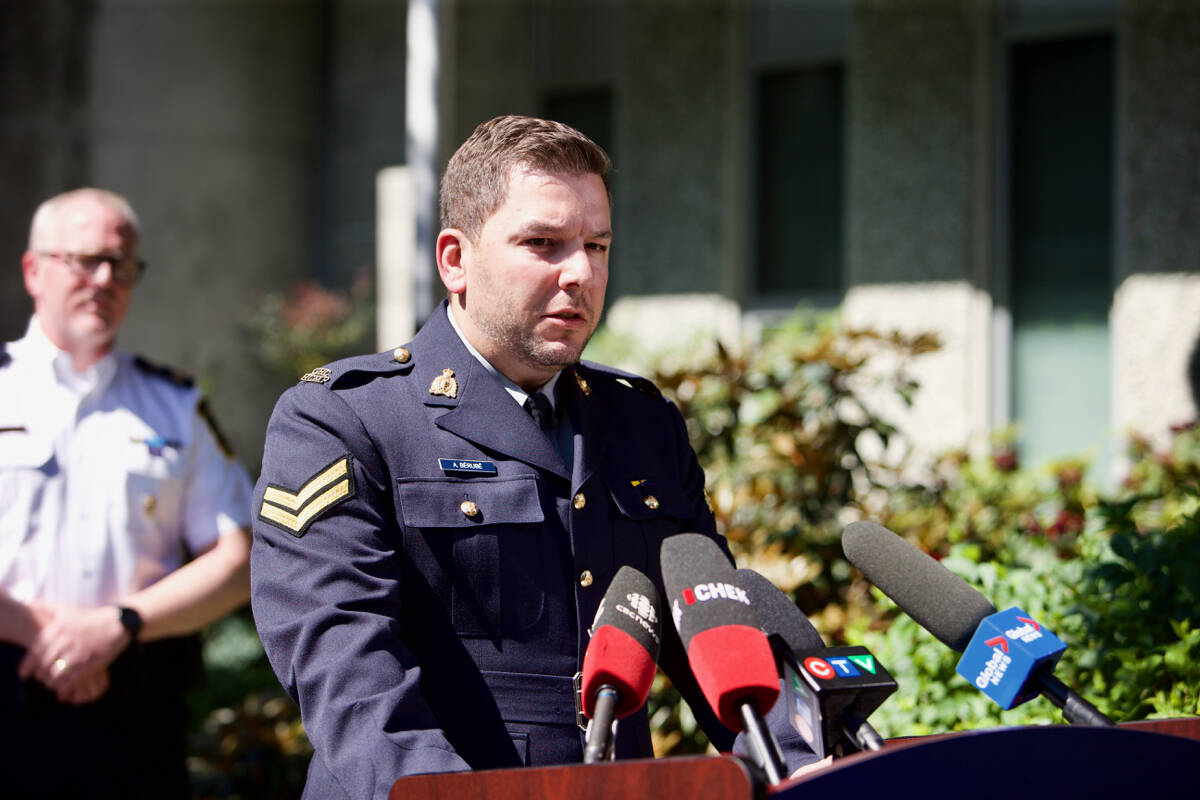 RCMP spokesperson Cpl. Alex Berube speaks to the media Thursday (June 30) to provide an update on the investigation into a bank robbery in Saanich Tuesday (June 28) which left two suspects dead and six police officers injured. (Justin Samanski-Langille/News Staff)