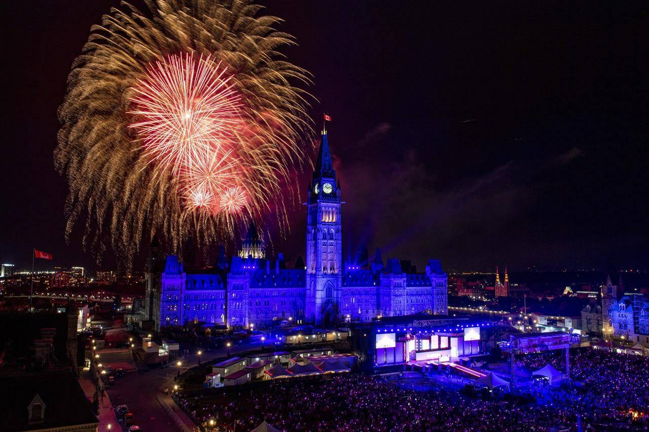 Fireworks explode above the Peace Tower and Centre Block during Canada Day celebrations on Parliament Hill in Ottawa on Monday, July 1, 2019. As Canada Day kicks off the unofficial start of summer, tourism firms are hopeful the first season in three years largely without COVID-19 restrictions will marshal a much-needed boost for a pandemic-stricken industry. THE CANADIAN PRESS/Justin Tang