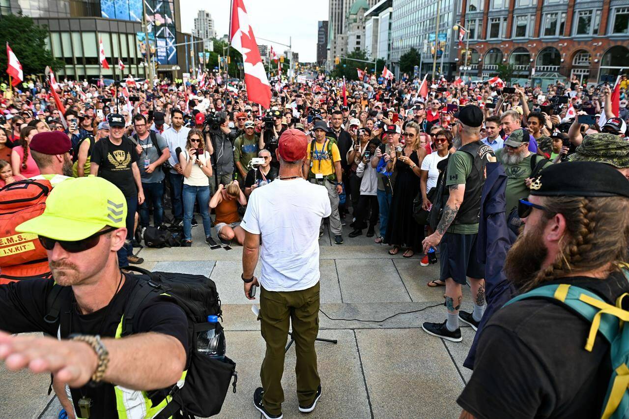 Army reservist James Topp speaks to the crowd during a protest against COVID-19 health measures at the National War Memorial in Ottawa, Ont. on Thursday, June 30, 2022. THE CANADIAN PRESS/Spencer Colby