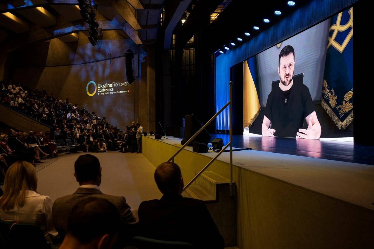 Ukrainian President Volodymyr Zelenskyy, delivers a speech by video conference during the Ukraine Recovery Conference URC, Monday, July 4, 2022 in Lugano, Switzerland. The URC is organised to initiate the political process for the recovery of Ukraine after the attack of Russia to its territory. (Alessandro della Valle/Keystone via AP)