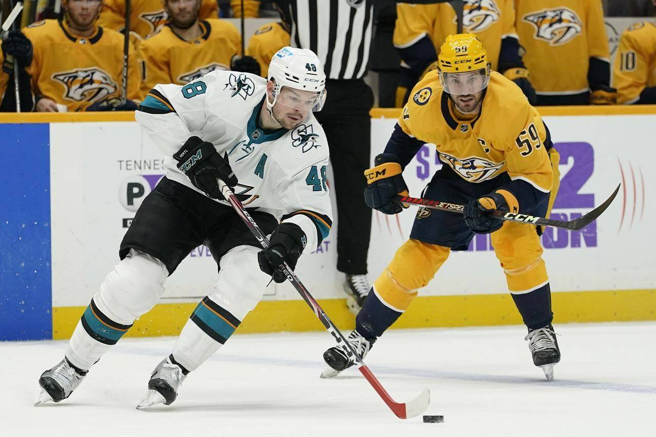San Jose Sharks’ Tomas Hertl (48) moves the puck ahead of Nashville Predators’ Roman Josi (59) in the first period of an NHL hockey game on April 12, 2022, in Nashville, Tenn. The NHL has announced its 2022-23 schedule, with the Predators and Sharks kicking off the season Oct. 7 at O2 Arena in Prague, Czech Republic. THE CANADIAN PRESS/AP-Mark Humphrey