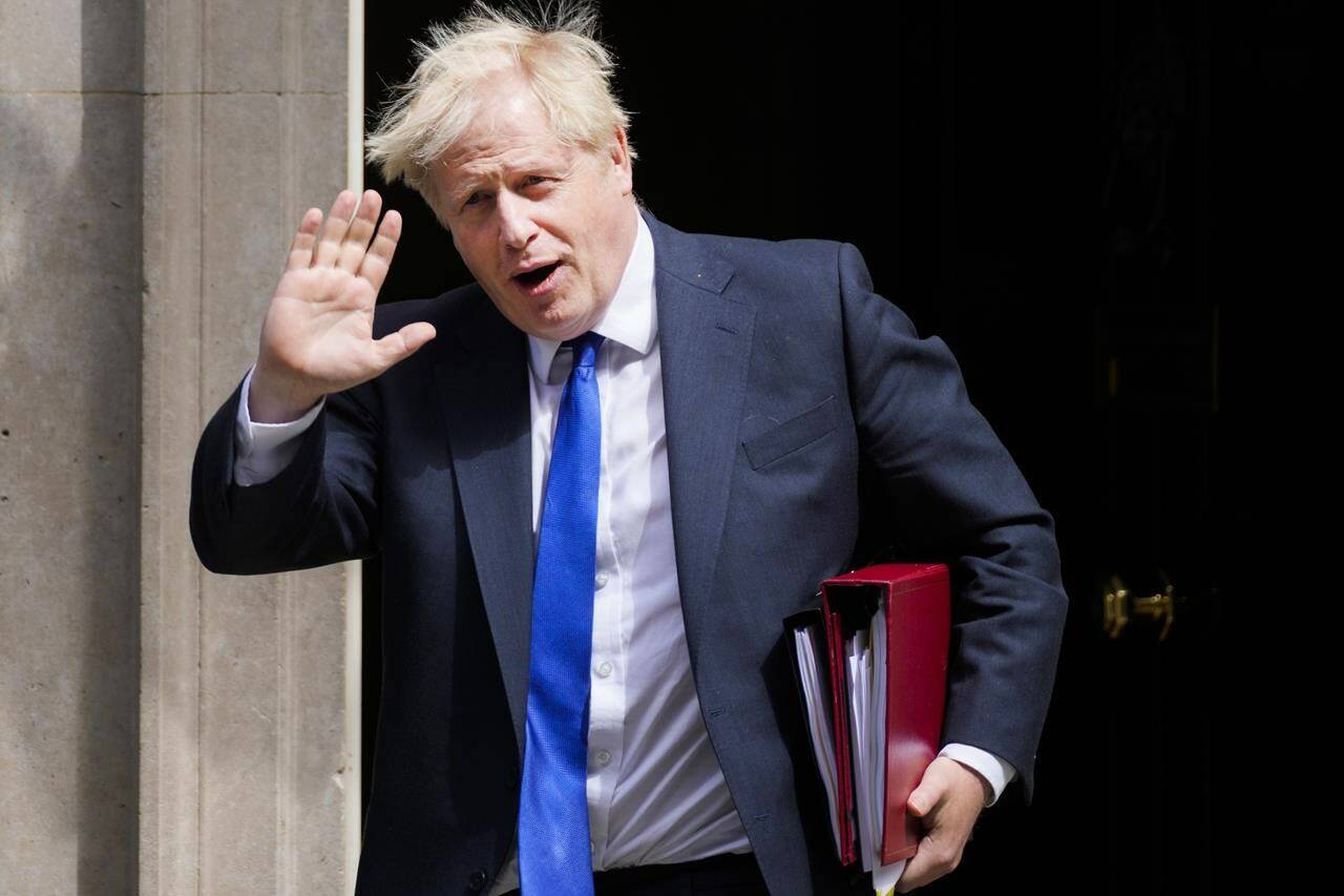 British Prime Minister Boris Johnson gestures as he leaves 10 Downing Street in London, Wednesday, July 6, 2022. (AP Photo/Frank Augstein)