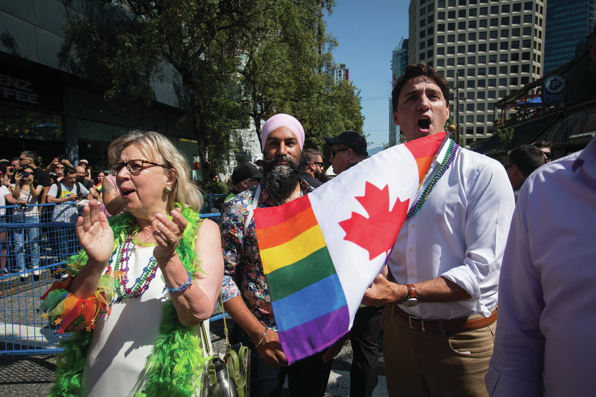 Prime Minister Justin Trudeau, right, cheers while waiting to march in the Vancouver Pride Parade with Green Party Leader Elizabeth May, left, and NDP Leader Jagmeet Singh, centre, in Vancouver in 2019. Do you know when Canadians received the right to same-sex marriages? (THE CANADIAN PRESS/Darryl Dyck)