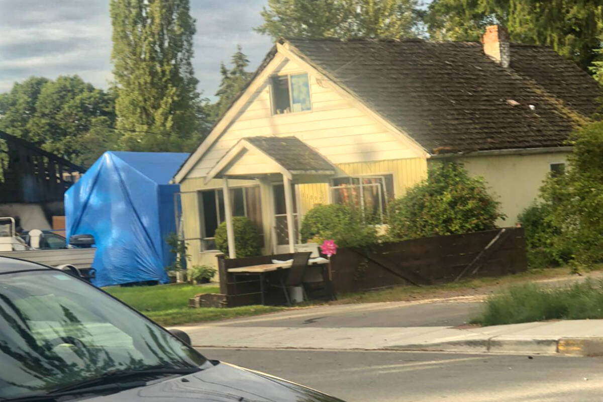 Armed police surrounded Maple Ridge home Thursday evening. Issue appears to be resolved but RCMP presence still strong in the suburban neighbourhood. (Special to The News)