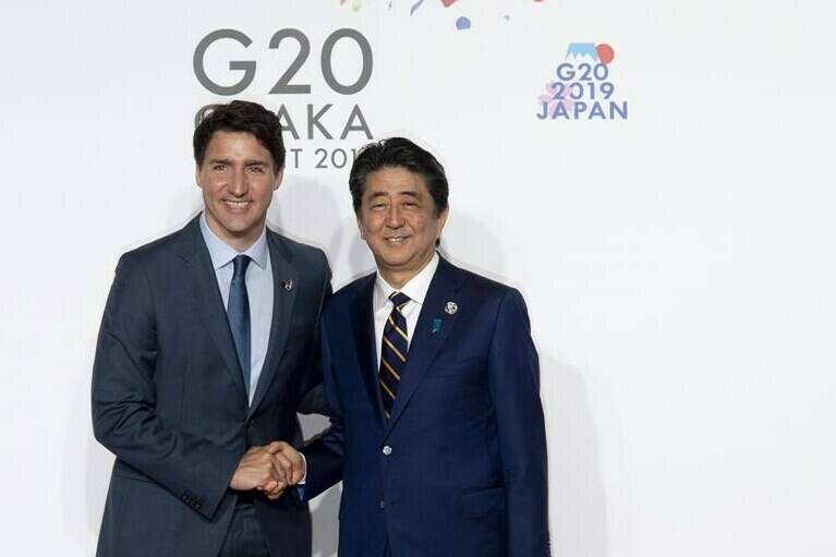 Japanese Prime Minister Shinzo Abe welcomes Canadian Prime Minister Justin Trudeau during the official welcome ceremony at the G20 Summit in Osaka, Japan on June 28, 2019. Prime Minister Justin Trudeau says the assassination of former Japanese prime minister Shinzo Abe is shocking, and that Canada has lost a close friend with his death. Abe was assassinated by a gunman who opened fire on him from behind as he delivered a campaign speech in western Japan. The 67-year-old Abe, who was Japan’s longest-serving leader when he resigned in 2020, collapsed bleeding and was airlifted to a nearby hospital where he was later pronounced dead. THE CANADIAN PRESS/Adrian Wyld