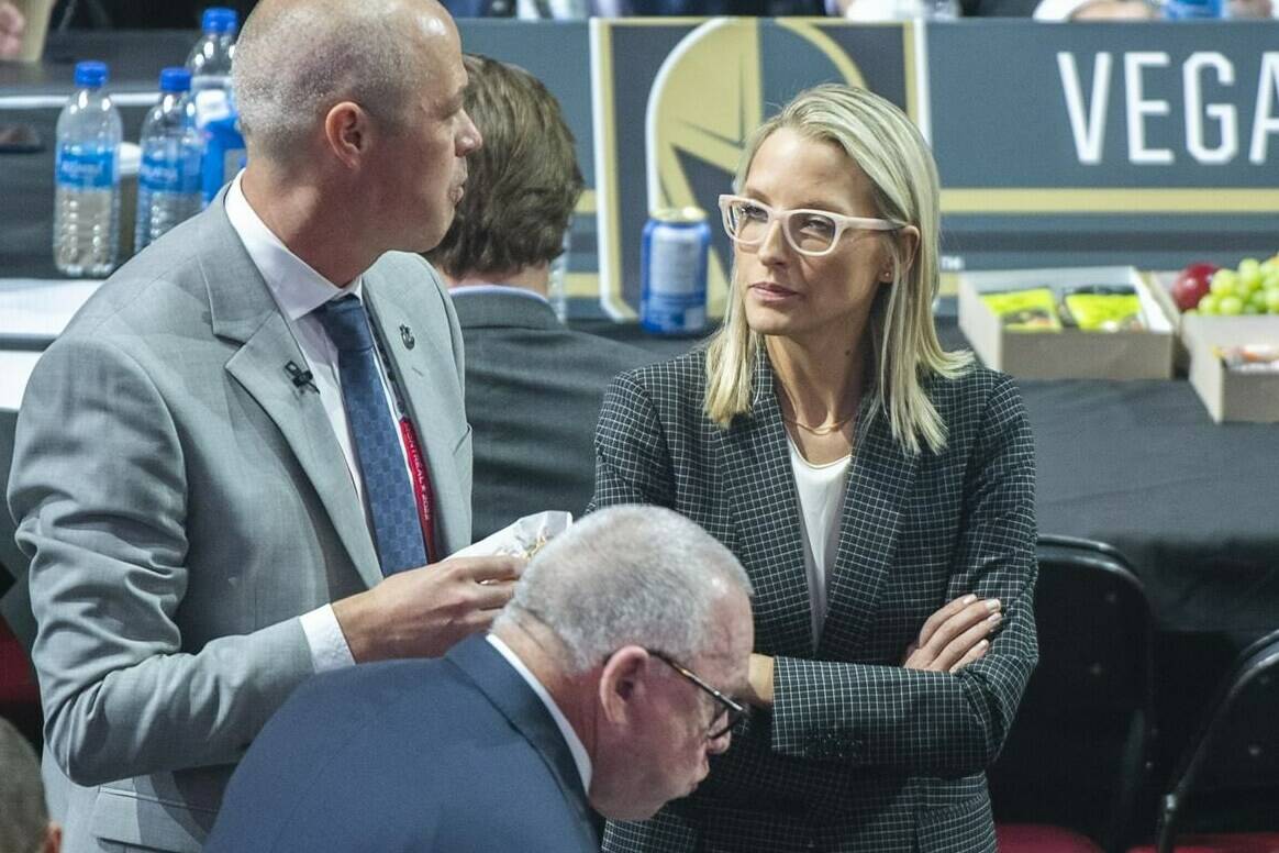 Vancouver Canucks assistant general manager Emilie Castonguay talks to GM Patrik Allvin during the first round of the NHL draft in Montreal, Thursday, July 7, 2022. THE CANADIAN PRESS/Graham Hughes.