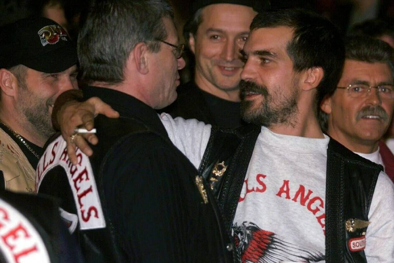 Maurice (Mom) Boucher, notorious Hells Angels biker imprisoned for murdering two prison guards, is dead at age 69. Boucher (2nd left), is greeted by other club members at a boxing match in Montreal in this 1998 file photo. THE CANADIAN PRESS/Ryan Remiorz