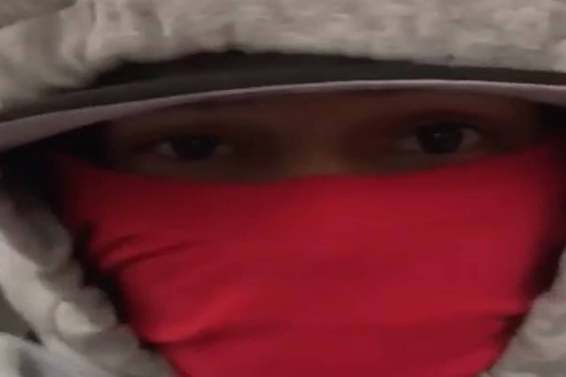 Image used in blackmail attempt, showing a person with red bandana over their face. (Burnaby RCMP photo)