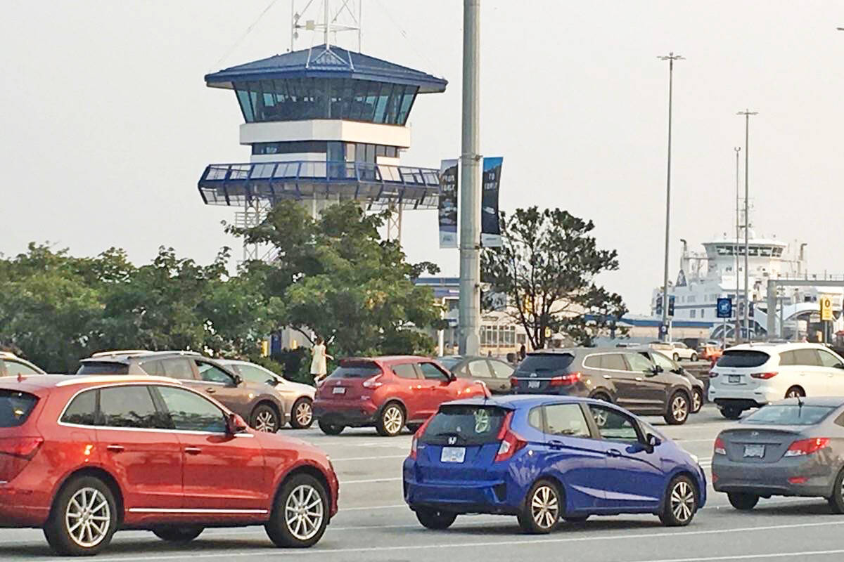 Vehicles line up to board B.C. Ferries sailing at Tsawwassen. British Columbia has the longest free ferry ride in the world. Do you know where this ferry can be found? (Black Press Media)