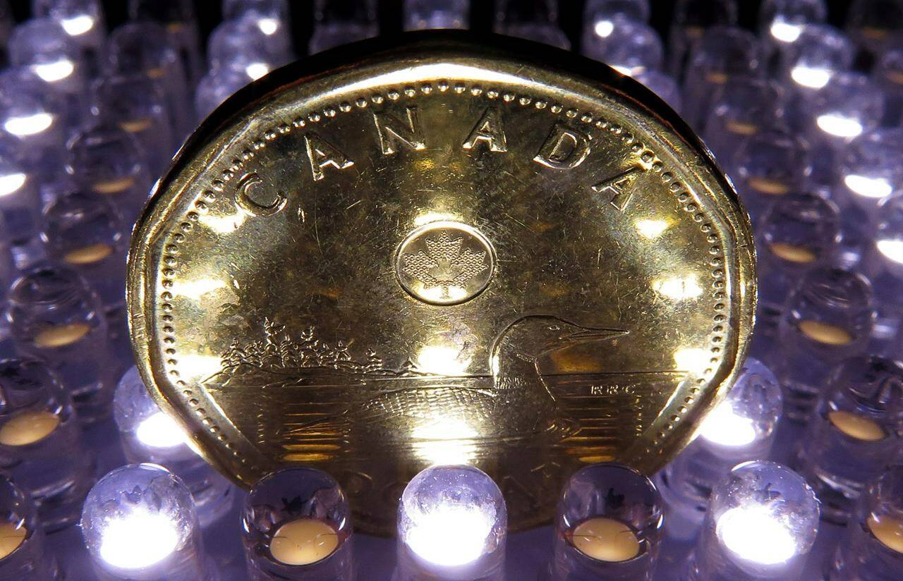 A loonie coin is pictured in North Vancouver, B.C. in April, 2014. It used to be said that a penny saved was a penny earned, but rising prices helped push out the penny years ago, and with inflation now running at well over seven per cent, it’s eating into every nickel and dime. THE CANADIAN PRESS/Jonathan Hayward