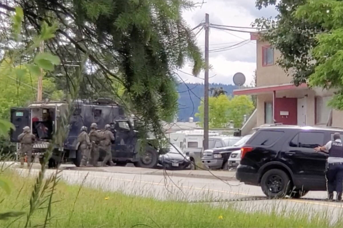 Williams Lake RCMP and North District Emergency Response Team officers respond to the corner of Smedley Street and Eleventh Avenue on Sunday, July 10. (Monica Lamb-Yorski photo - Williams Lake Tribune)