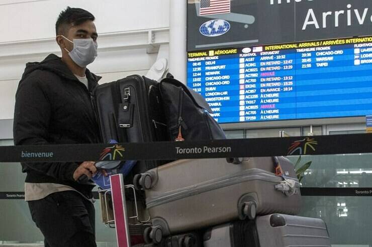 A passenger arrives from New Delhi at Pearson Airport in Toronto on April 21, 2021. Infectious disease experts are at odds over the value of testing random travellers into the country for COVID-19 as the federal government relaunched its airport test program Tuesday. THE CANADIAN PRESS/Frank Gunn