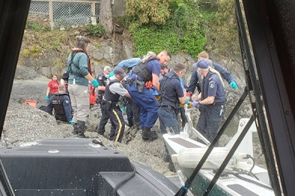 Canadian and U.S. responders resuscitated a man near Sidney on July 15 after a couple found him unresponsive in the water. (Courtesy of Sidney/North Saanich RCMP)