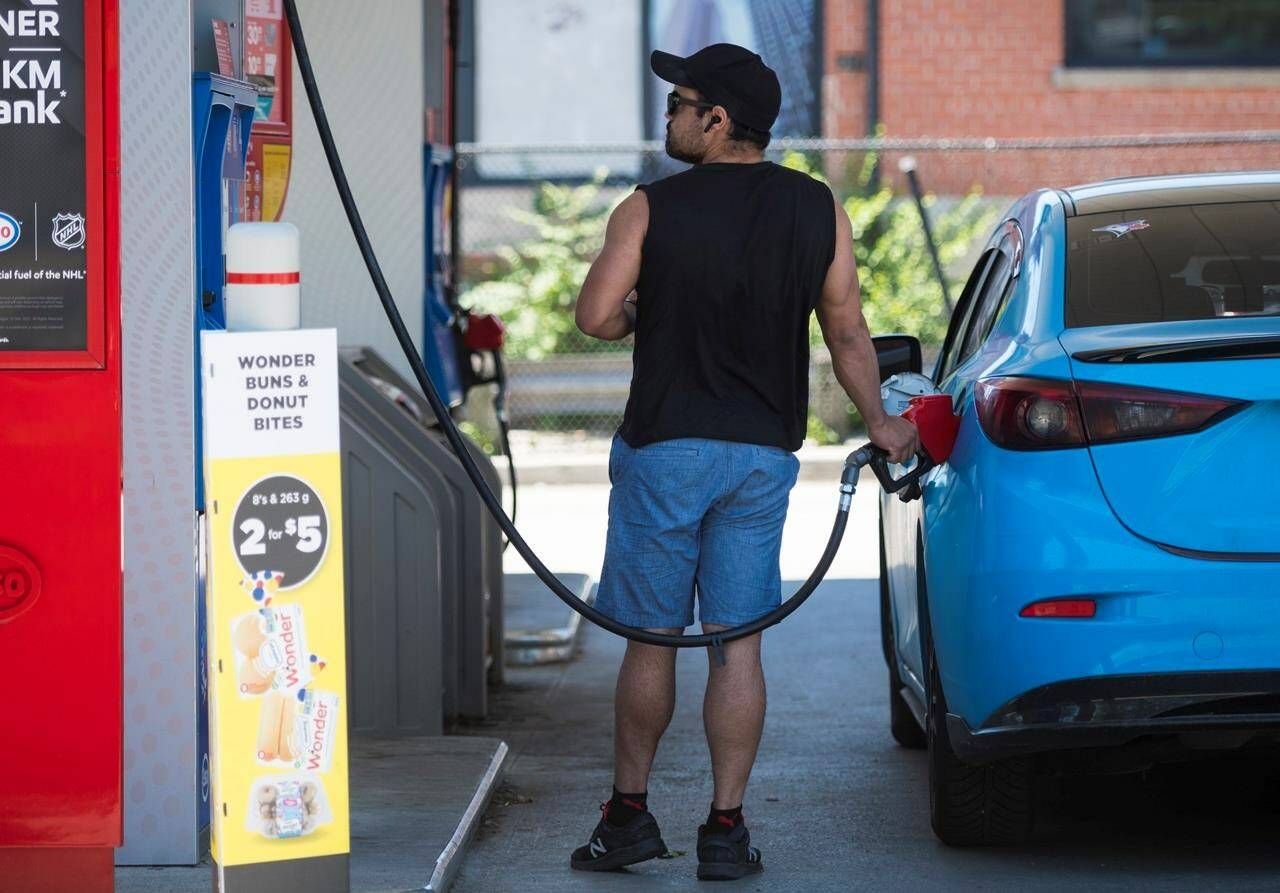 Canada’s inflation rate reached 8.1 per cent in June on a year-over-year basis as prices for most goods and services continued to rise. A commuter pumps gas into their vehicle at a Esso gas station in Toronto on Tuesday, June 15, 2021. THE CANADIAN PRESS/ Tijana Martin