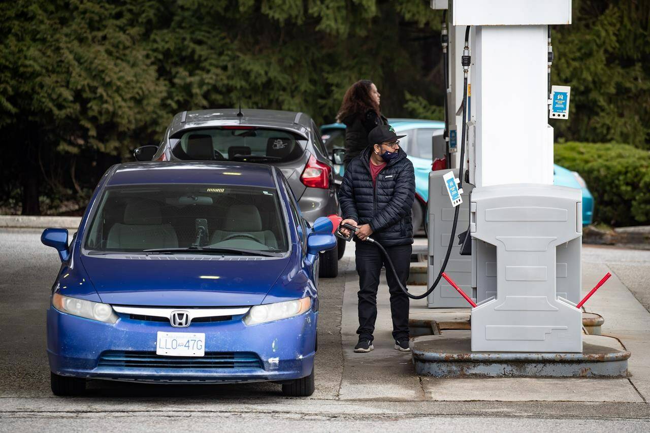 Statistics Canada says retail sales rose 2.2 per cent to $62.2 billion in May, led higher by sales at new car dealers and gas stations. People fuel up their vehicles at a Shell gas station, in Burnaby, B.C., on Wednesday, March 2, 2022. THE CANADIAN PRESS/Darryl Dyck