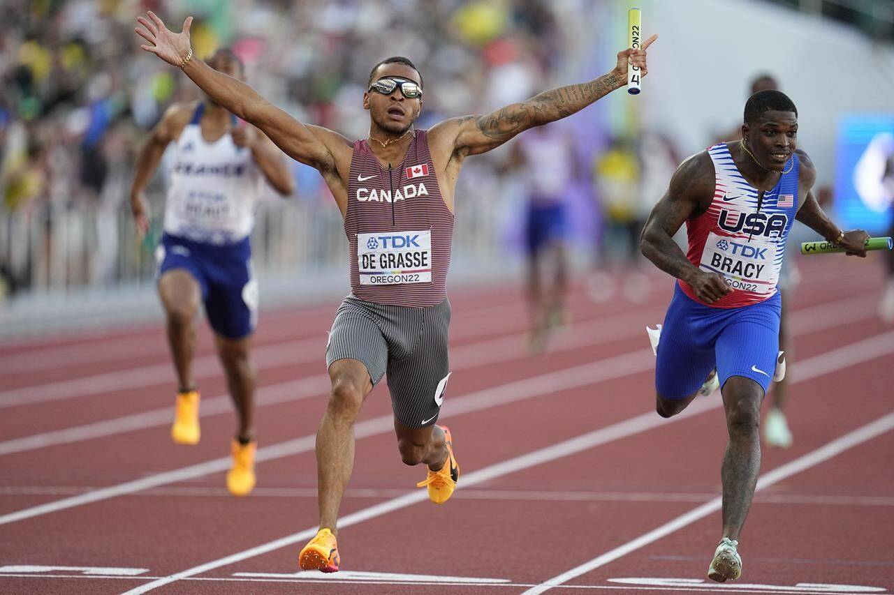 Andre De Grasse, of Canada, wins the final in the men’s 4x100-meter relay at the World Athletics Championships on Saturday, July 23, 2022, in Eugene, Ore. Sprinter Andre De Grasse and decathlete Pierce LePage are among the top Canadian track and field stars who have withdrawn from competing at the upcoming Commonwealth Games. THE CANADIAN PRESS/AP - Ashley Landis