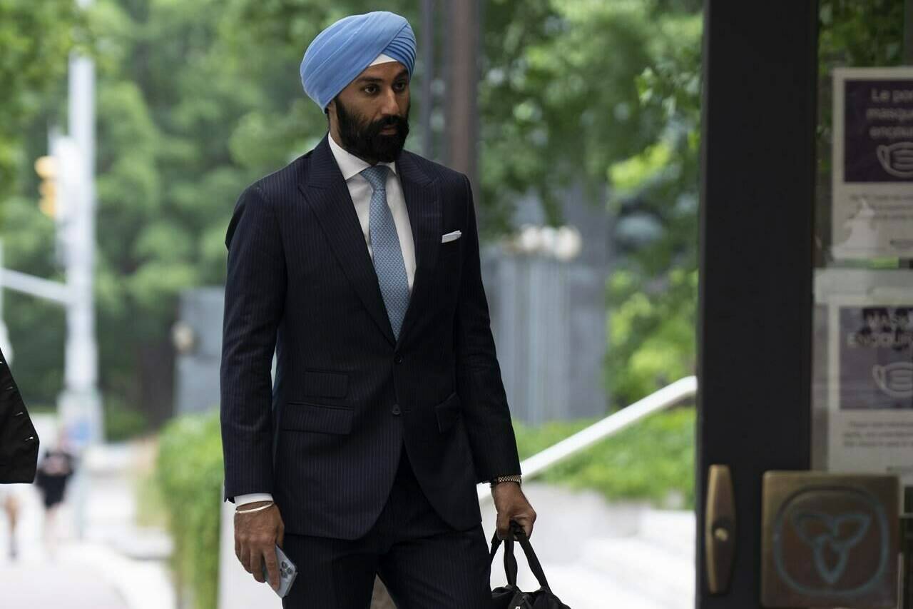 The trial for former Liberal MP Raj Grewal, who stands accused of using his political office for personal financial gain, will extend until at least this fall. Grewal makes his way to court, Monday, July 18, 2022 in Ottawa. THE CANADIAN PRESS/Adrian Wyld