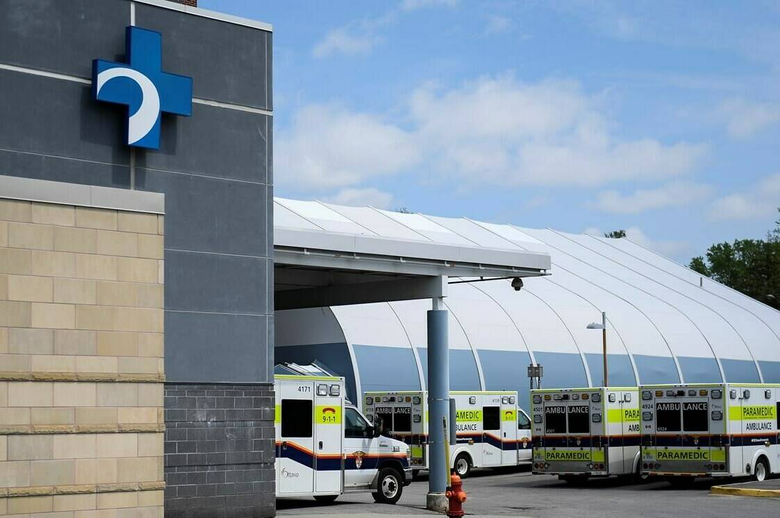 Ambulances are parked outside the Emergency Department at the Ottawa Hospital Civic Campus in Ottawa on Monday, May 16, 2022. THE CANADIAN PRESS/Justin Tang