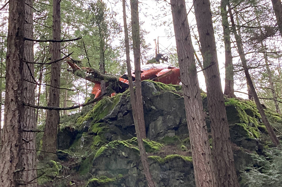 A crashed helicopter is seen near Mt. Gardner on Bowen Island on Friday March 5, 2021. Two people were taken to hospital in serious but stable condition after the crash. (Irene Paulus/contributed)
