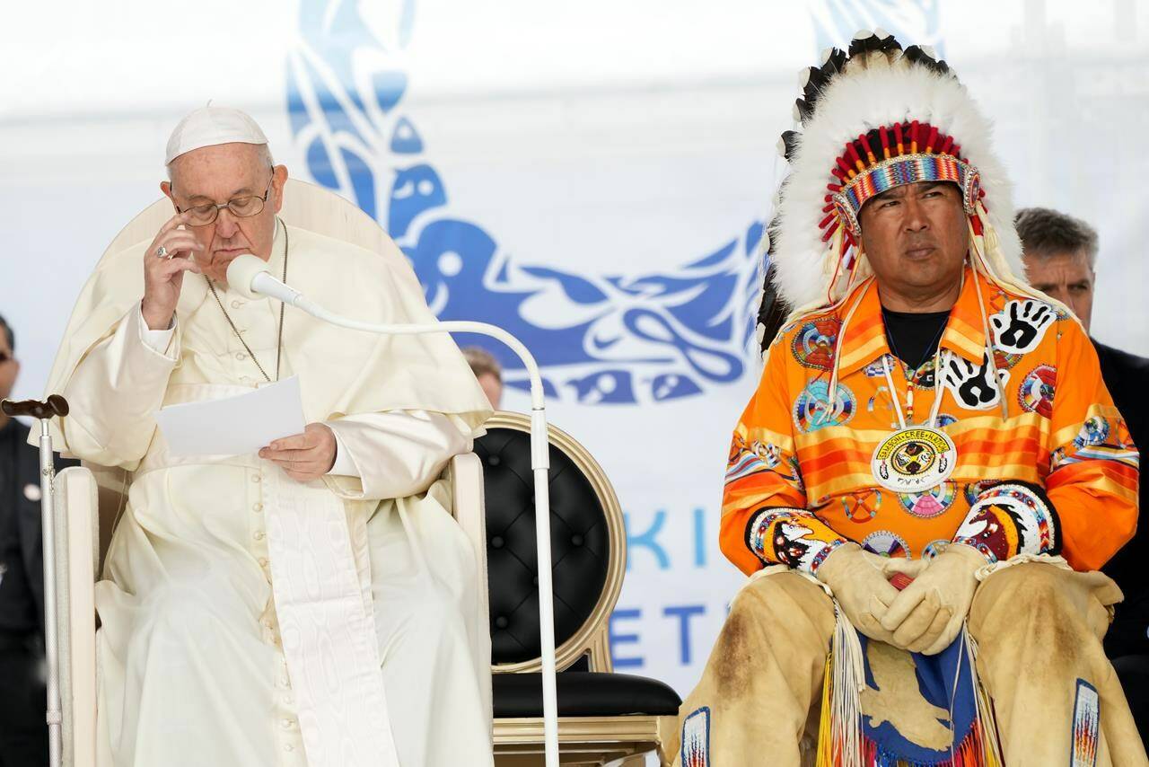 Pope Francis delivers his apology to Indigenous people for the church’s role in residential schools as Samson Cree Nation Chief Vernon Saddleback looks on during a ceremony in Maskwacis, Alta., as part of his papal visit across Canada on Monday, July 25, 2022. THE CANADIAN PRESS/Nathan Denette