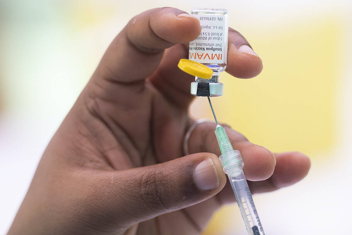 A health-care worker prepares monkeypox vaccine in Montreal, Saturday, July 23, 2022. Tourists are among those lining up to get monkeypox vaccines in Montreal, as the World Health Organization declares the virus a global health emergency. THE CANADIAN PRESS/Graham Hughes