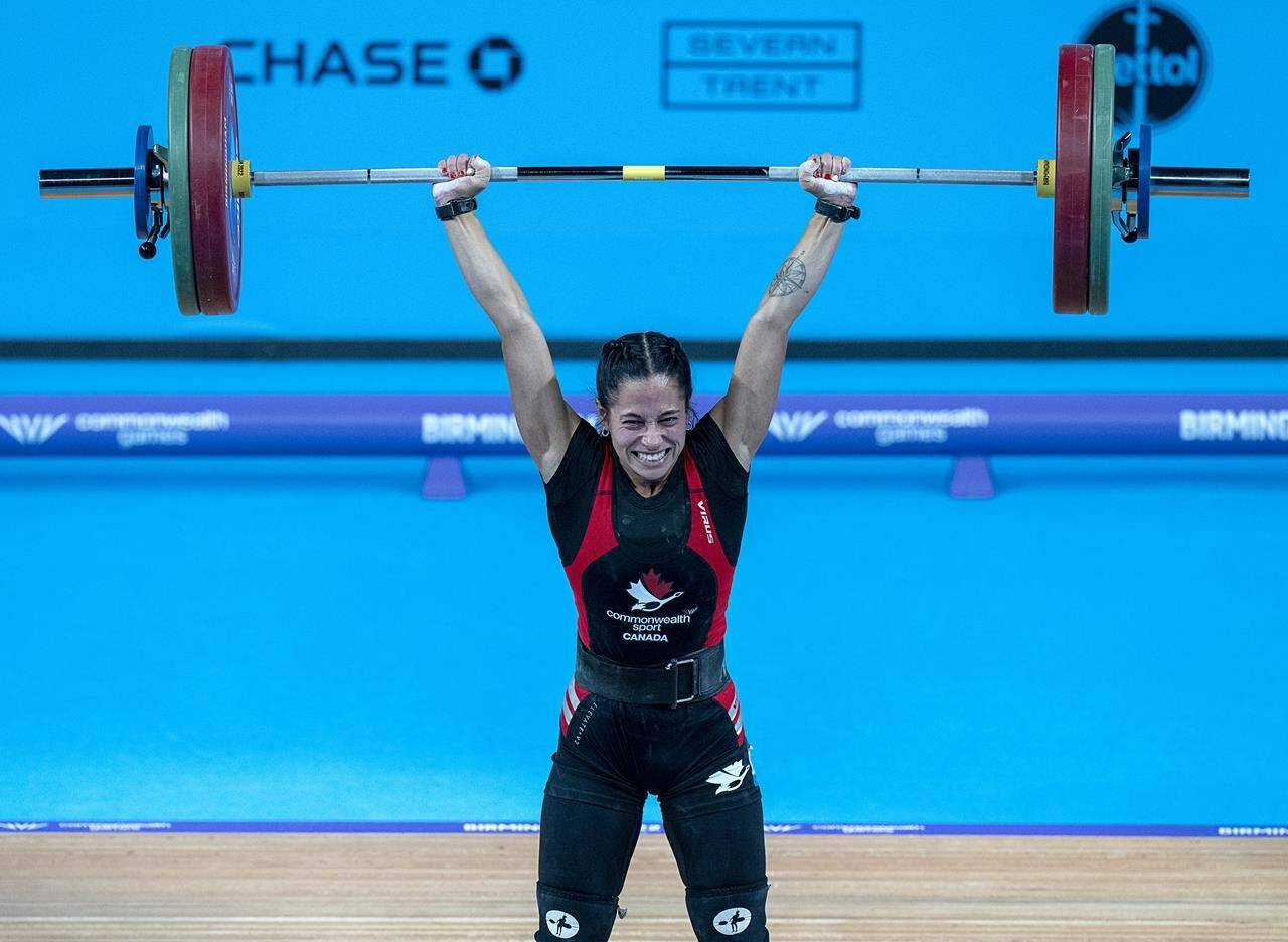 Canada's Hannah Kaminski, from Calgary, lifts her way to a bronze medal in the women's 49 kg weightlifting event at the Commonwealth Games in Birmingham, England on Saturday, July 30, 2022. THE CANADIAN PRESS/Andrew Vaughan