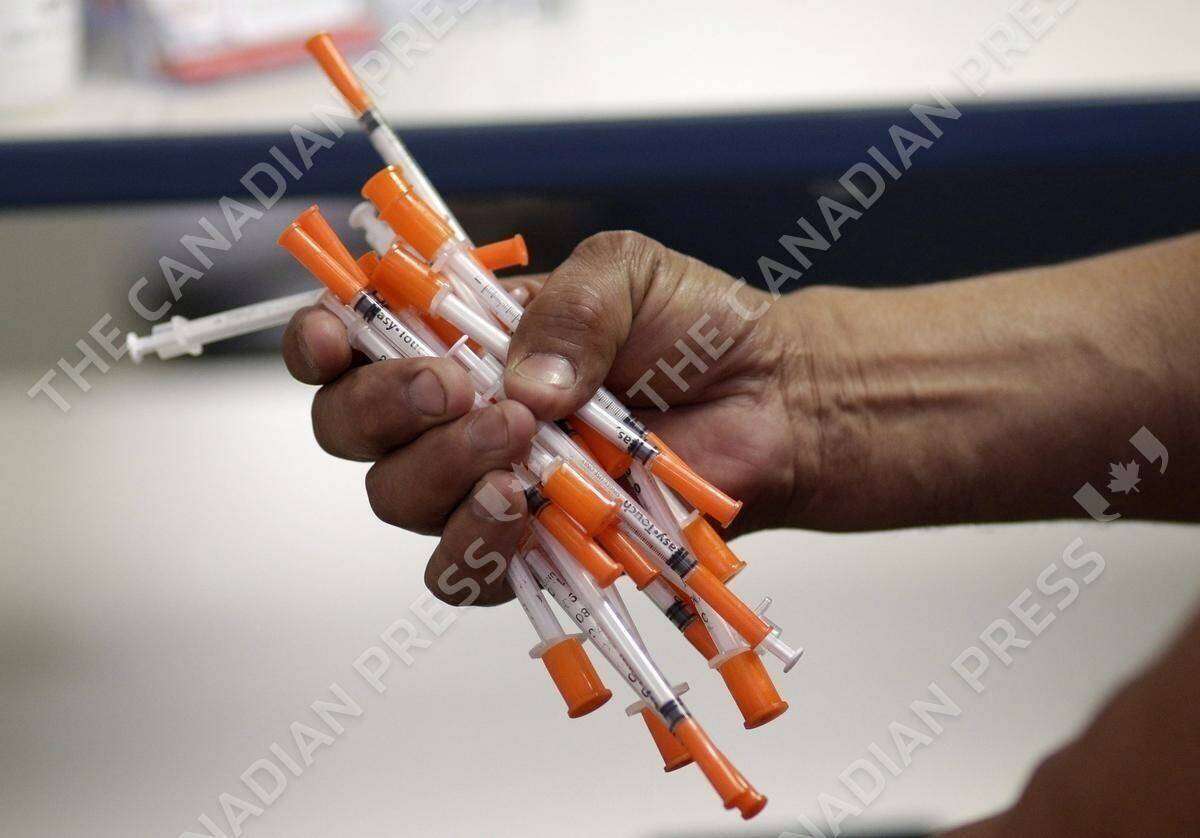 Used needles are shown at a needle exchange in Miami, May 6, 2019. Despite pandemic slow-downs, Correctional Service Canada is still planning to expand the needle exchange programs currently offered at nine federal prisons, government officials say. THE CANADIAN PRESS/AP/Lynne Sladky