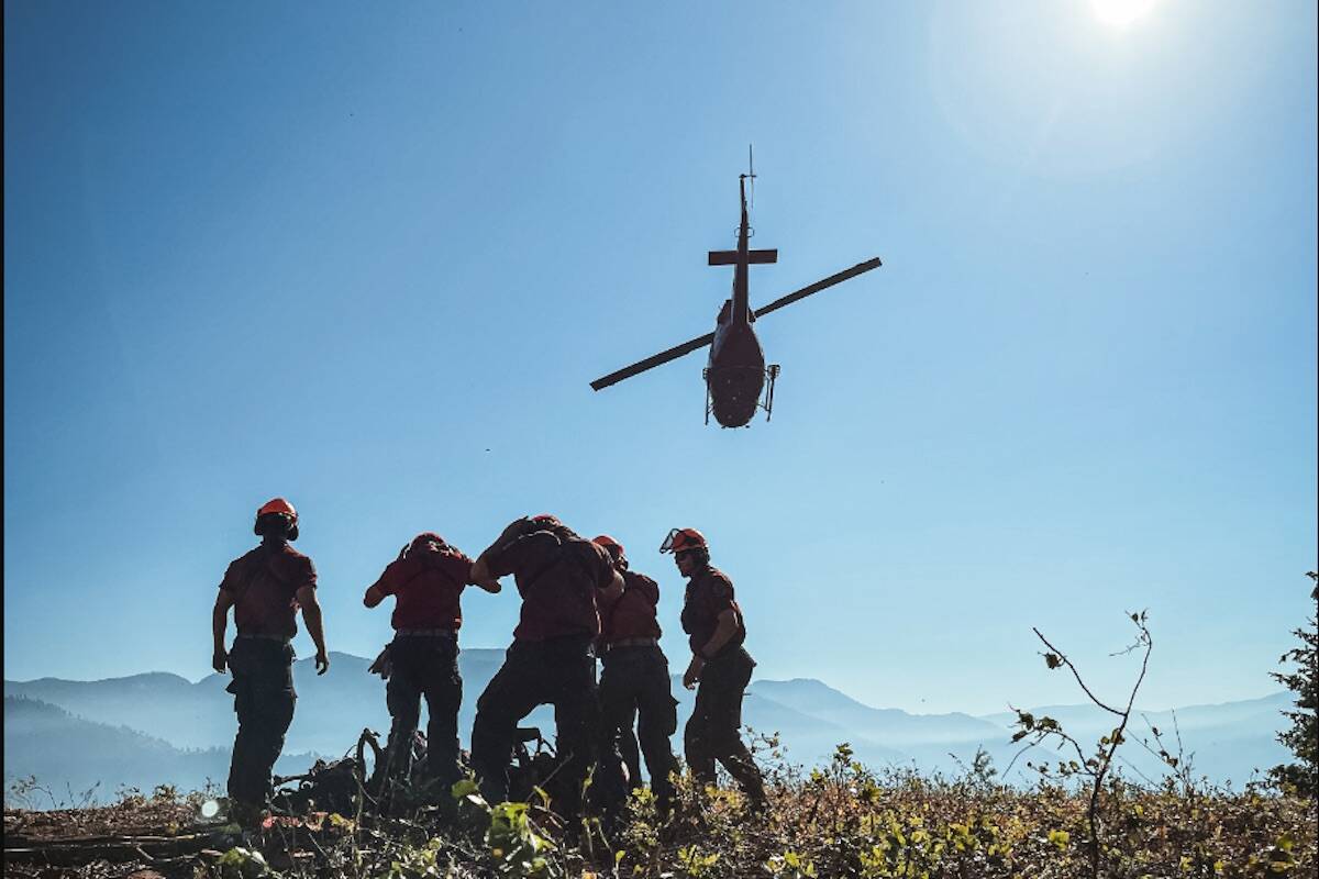 Dozens of firefighters and 11 helicopters continue to battle the Nohomin Creek blaze Aug. 2. (Courtesy of BC Wildfire Service)