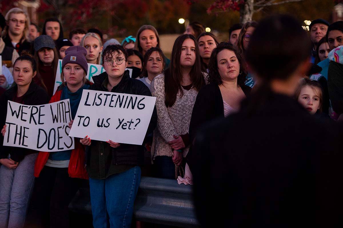 People protest the mishandling of sexual assault cases at a university campus on Nov. 4, 2021. In B.C., the number of reported sexual assaults in 2021 leapt 15 per cent over the year before. (Kendall Warner/The News Advance via AP)