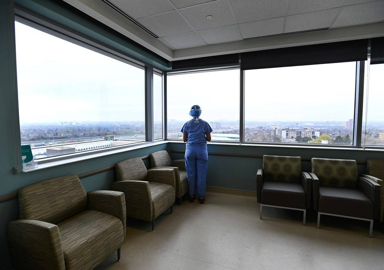A nurse looks out the window in the ICU at the Humber River Hospital in Toronto. A B.C. nurse was handed a two-week suspension Aug. 3 for neglecting a resident. THE CANADIAN PRESS/Nathan Denette