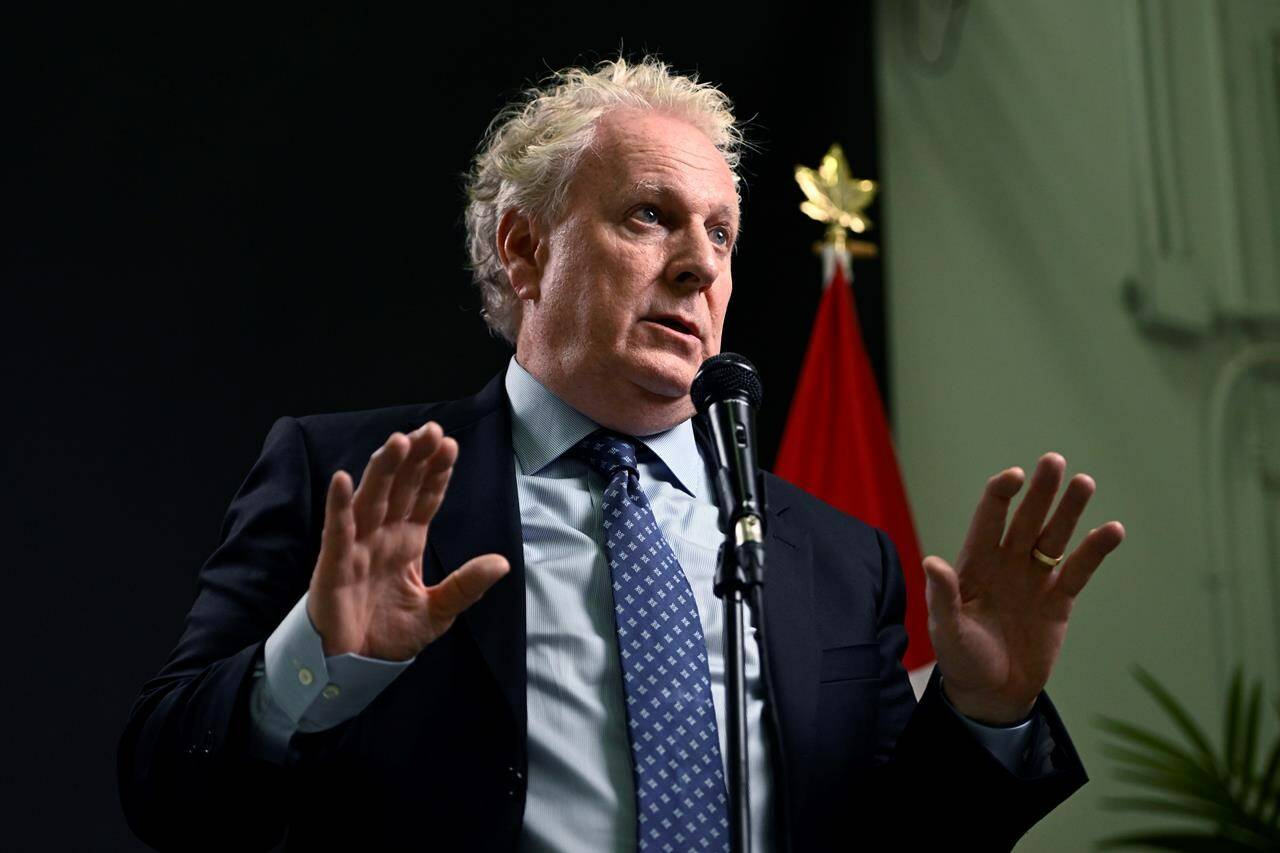 Conservative Leadership candidate Jean Charest answers questions from reporters after the third debate of the 2022 Conservative Party of Canada leadership race, in Ottawa, on Wednesday, Aug. 3, 2022. Charest compared opponents who didn’t show up to federal Conservatives’ last debate of the race to a fish not wanting to swim.THE CANADIAN PRESS/Justin Tang