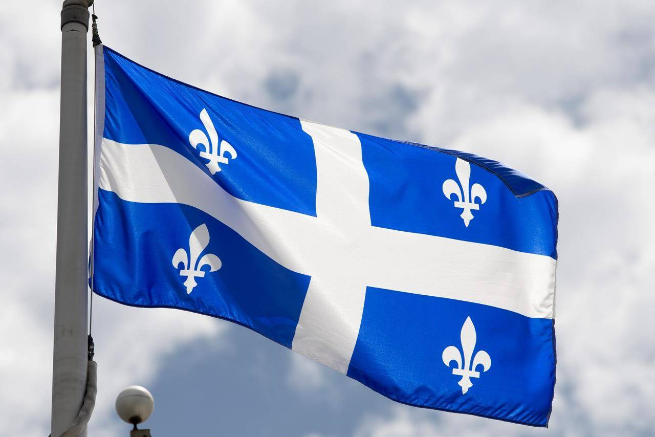 Quebec’s provincial flag flies on a flag pole in Ottawa, Friday July 3, 2020. THE CANADIAN PRESS/Adrian Wyld