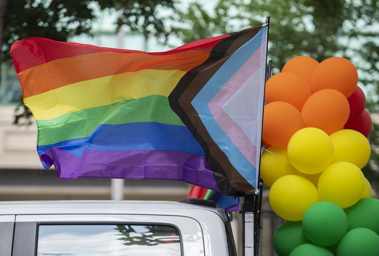 Rainbow flags and coloured balloons are shown at the site where the Montreal Pride parade was supposed to start from in Montreal, Sunday, August 7, 2022. Festival organizers cancelled the parade over concerns for security due to the lack of staff. THE CANADIAN PRESS/Graham Hughes