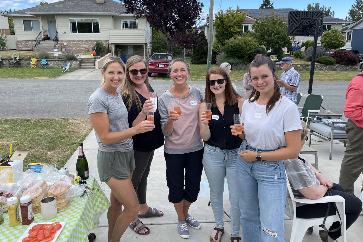 Residents enjoy a block party gathering Aug. 4 on Elm Street in Saanich, organized as a way to help people come together and continue healing following the June 28 shootout at the nearby BMO Bank of Montreal branch on Shelbourne Street. (Courtesy of Rebecca Kirkwood)