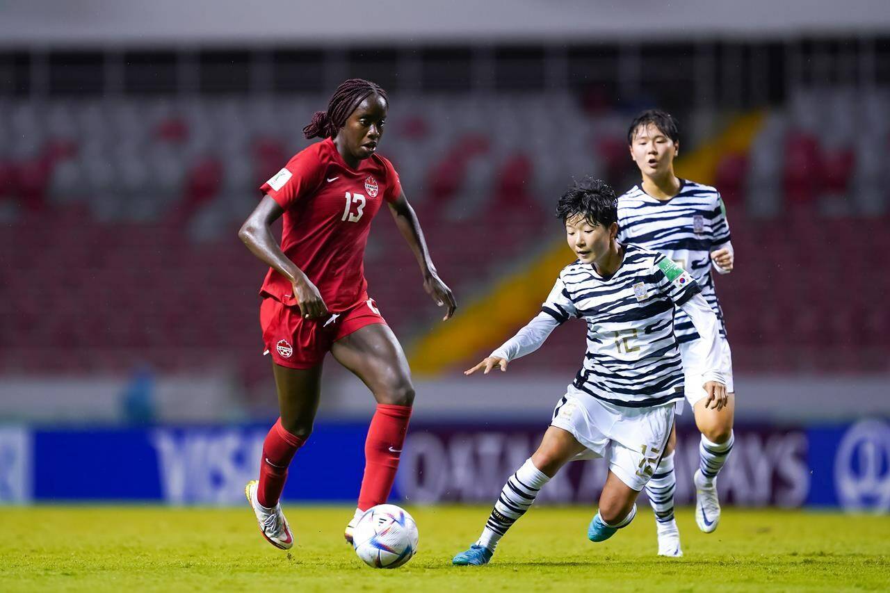 Canada’s Simi Awujo, left, controls the ball during FIFA U-20 Women’s World Cup action as South Korea’s Lee Seran defends in San Jose, Costa Rica on Thursday Aug. 11, 2022. (HO-Canada Soccer-Daniela Porcelli/CP)