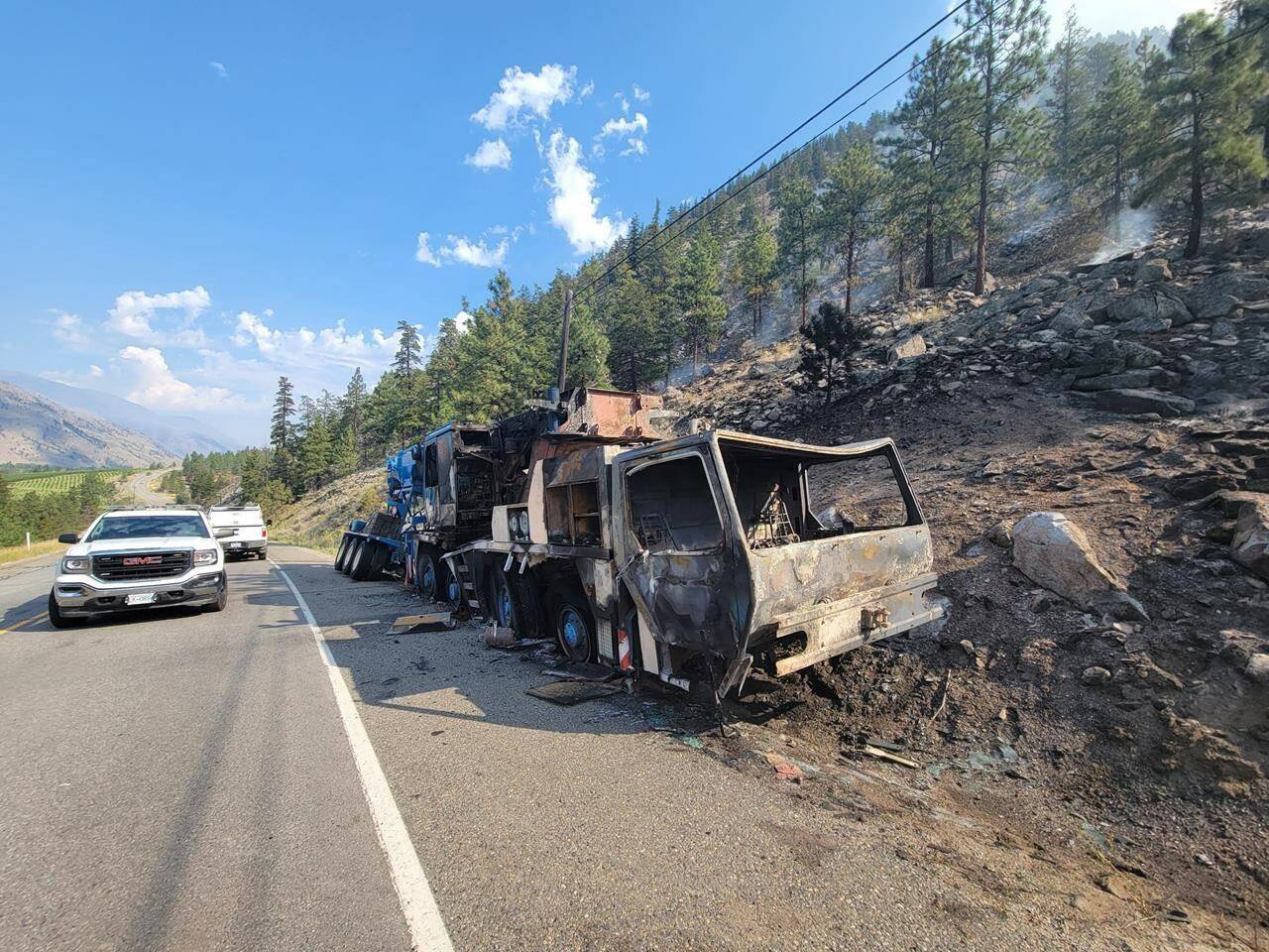 A burned out vehicle is shown after an accident sparked a wildfire on Highway 3 west of Osoyoos near Richter Mountain in this recent handout photo. Residents near the blaze have been told they may have to leave at a moment's notice. THE CANADIAN PRESS/HO - Okanagan-Similkameen Regional District