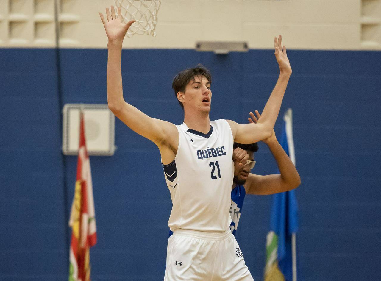 Team Quebec's Olivier Rioux plays in a men's basketball quarterfinal game against Team Alberta at the 2022 Canada Summer Games in Welland, Ontario Thursday, August 11, 2022. The 16-year-old from Anjou, Quebec is 7-foot-6 and recognized by Guinness World Records as the tallest teen in the world. THE CANADIAN PRESS/Tara Walton