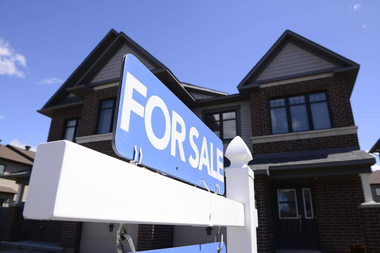 The Canadian Real Estate Association says home sales fell for the fifth consecutive month between June and July but this month’s drop was the smallest of the five. A new home is displayed for sale in a new housing development in Ottawa on Tuesday, July 14, 2020. THE CANADIAN PRESS/Sean Kilpatrick