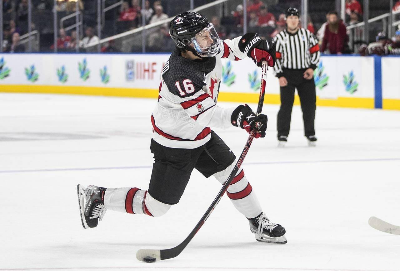 Canada’s Connor Bedard (16) takes the shot against Latvia during second period IIHF World Junior Hockey Championship action in Edmonton on August 10, 2022. THE CANADIAN PRESS/Jason Franson