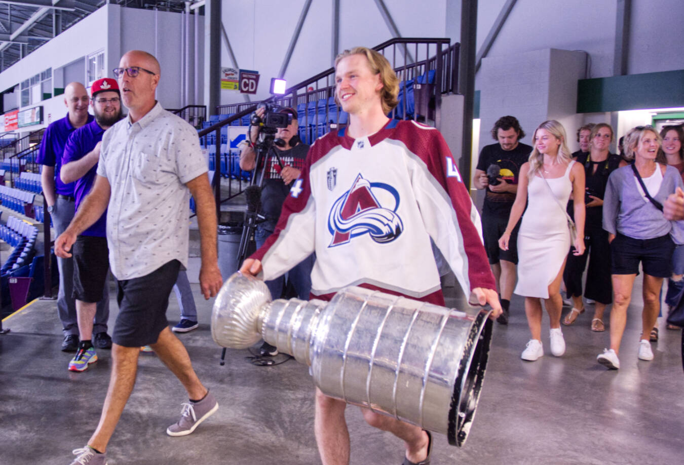 Bowen Byram, accompanied by friends and family, enters Western Financial Place with the Stanley Cup, Tuesday, August 16, for a public meet and greet. (Trevor Crawley photo)