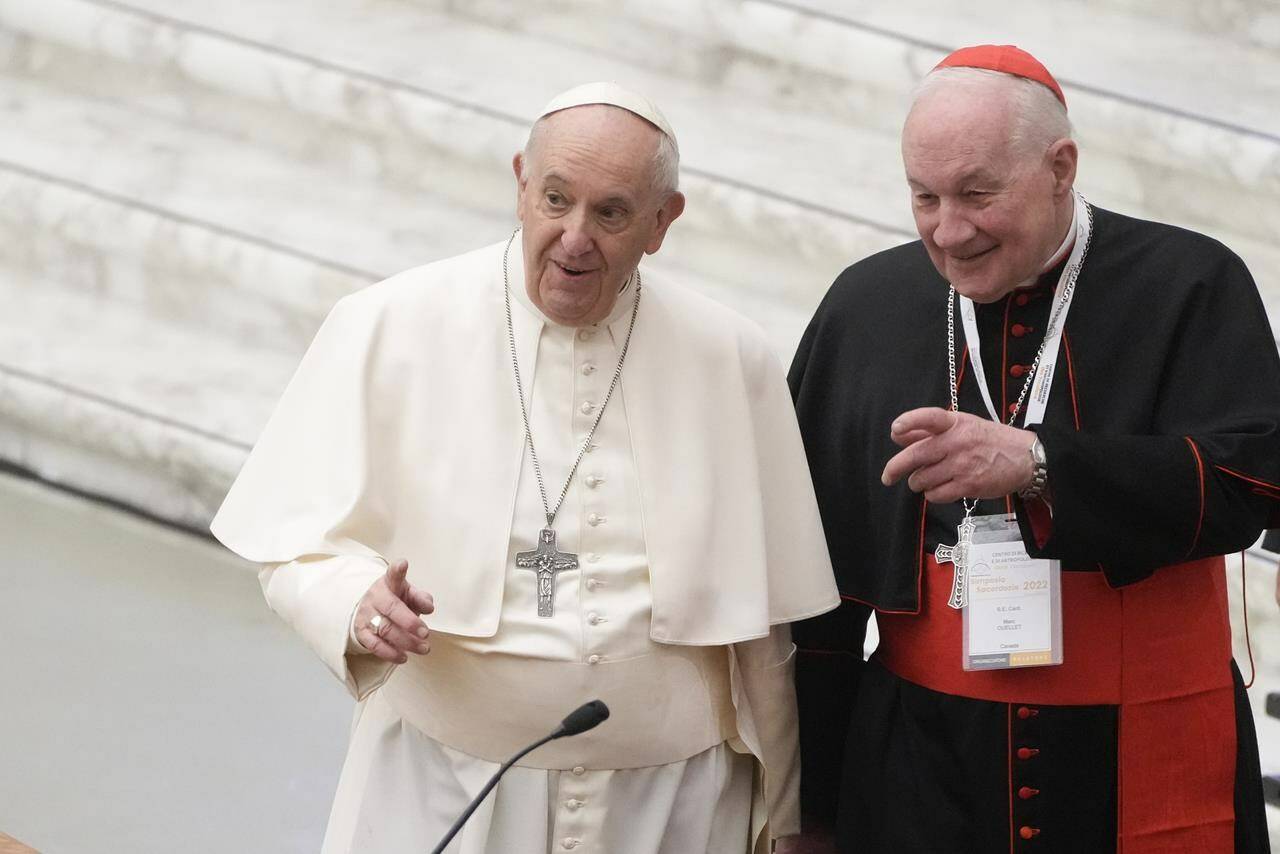 Pope Francis, left, and Cardinal Marc Ouellet arrive at the opening of a 3-day Symposium on Vocations in the Paul VI hall at the Vatican on Feb. 17, 2022. A series of claims made against Quebec clergy members in two class-action lawsuits against the church could be groundbreaking for victims who aren’t children. THE CANADIAN PRESS/AP, Gregorio Borgia