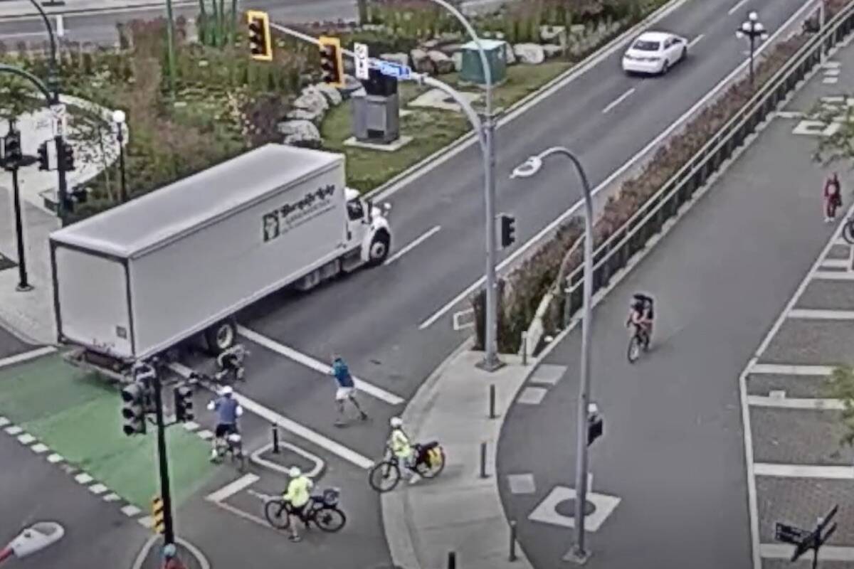 A live streaming video facing the intersection of Pandora and Store streets captured the moment a cyclist was struck by a truck July 5. (Swans/Youtube)