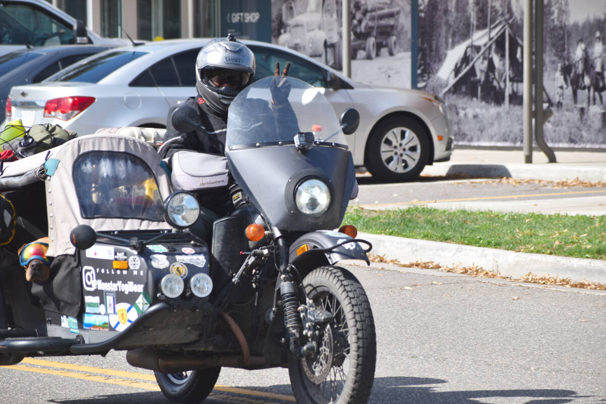 Lyna Smith left the Quesnel Visitor Centre on Monday, Aug. 15 on her Ural motorcycle with her dog, Monster Yogi Bear riding in a sidecar. The pair from Port Elgin, Ont. have been travelling across Canada since late April. (Rebecca Dyok photo — Quesnel Observer)