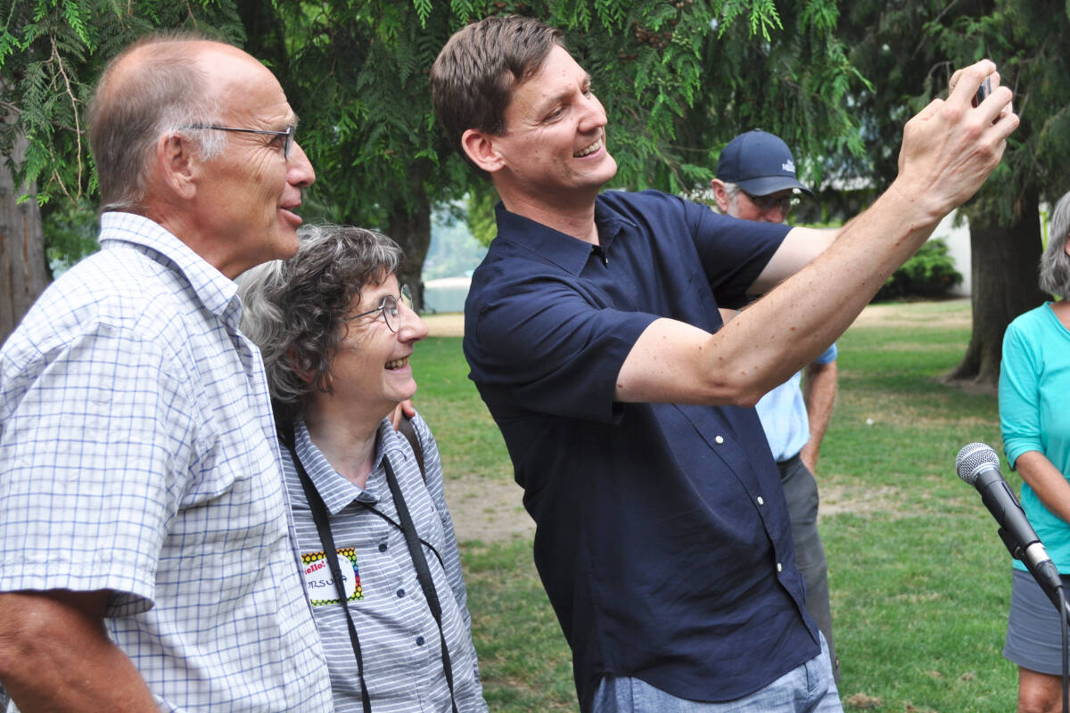 David Eby takes a selfie with two supporters during a campaign event in Nelson on Saturday. Eby is one of two NDP candidates running to replace John Horgan as the party’s leader and B.C.’s premier. Photo: Tyler Harper