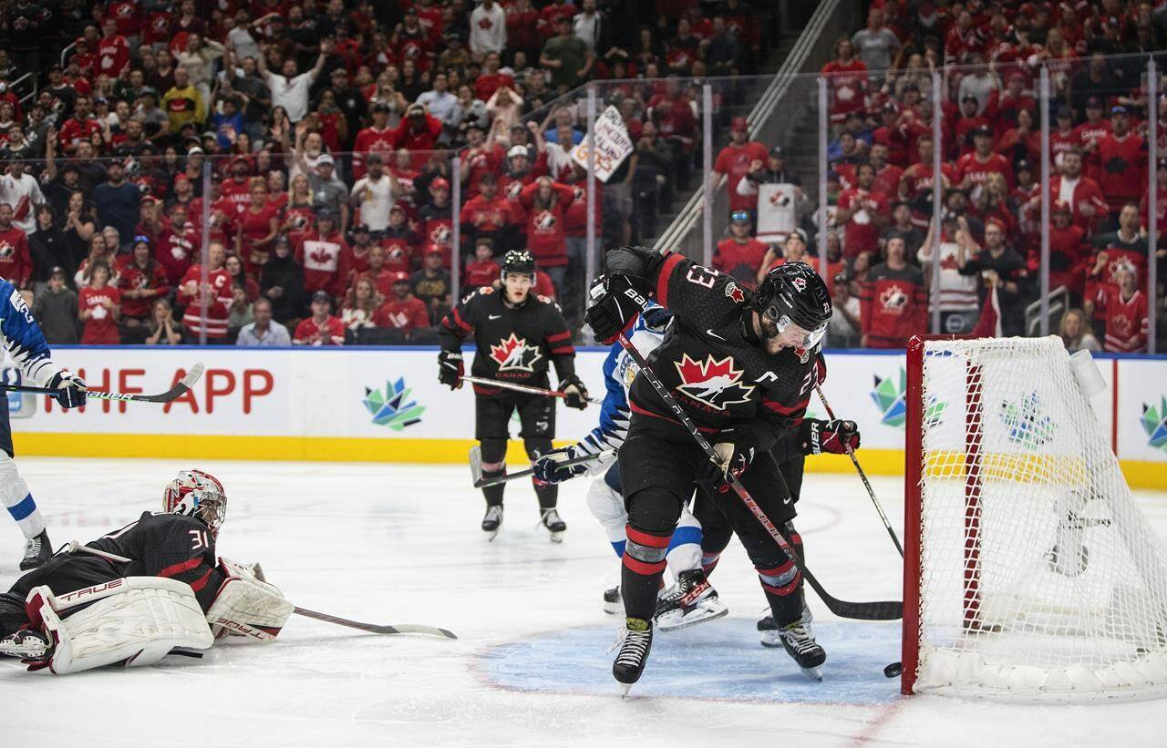 Canada’s Mason McTavish (23) saves the puck from going into the net on a shot from Finland during overtime IIHF World Junior Hockey Championship gold medal game action in Edmonton on Saturday August 20, 2022. THE CANADIAN PRESS/Jason Franson