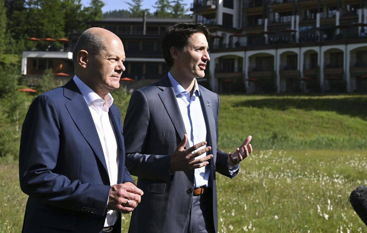 German Chancellor Olaf Scholz, left, and the Prime Minister of Canada, Justin Trudeau, right, give a statement during their bilateral meeting on the sidelines of the G7 summit at Castle Elmau in Kruen, near Garmisch-Partenkirchen, Germany, on Monday, June 27, 2022. THE CANADIAN PRESS/Kerstin Joensson/Pool Photo via AP