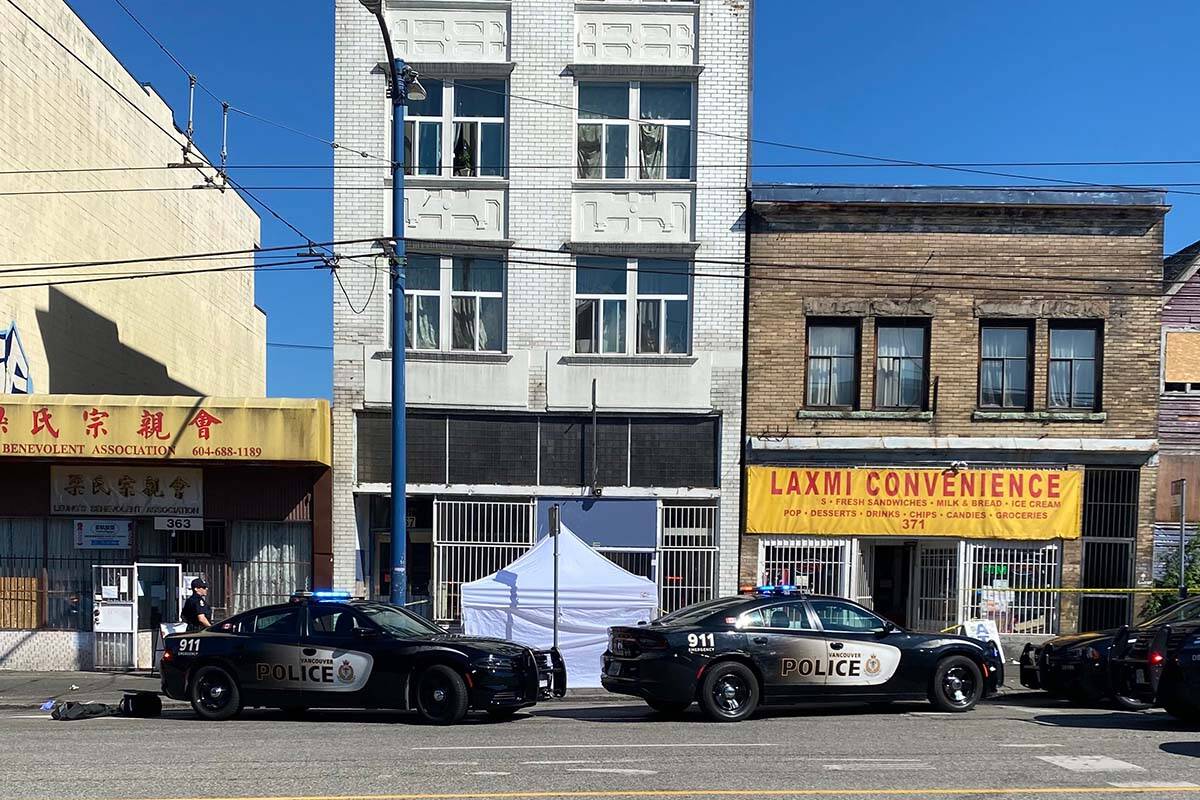 A photo outside the Vancouver Area Network of Drug Users (VANDU) building on East Hastings Street Aug. 22 shows a white tent set up where a man died after police reportedly used a bean bag gun on him. (VANDU/Twitter)