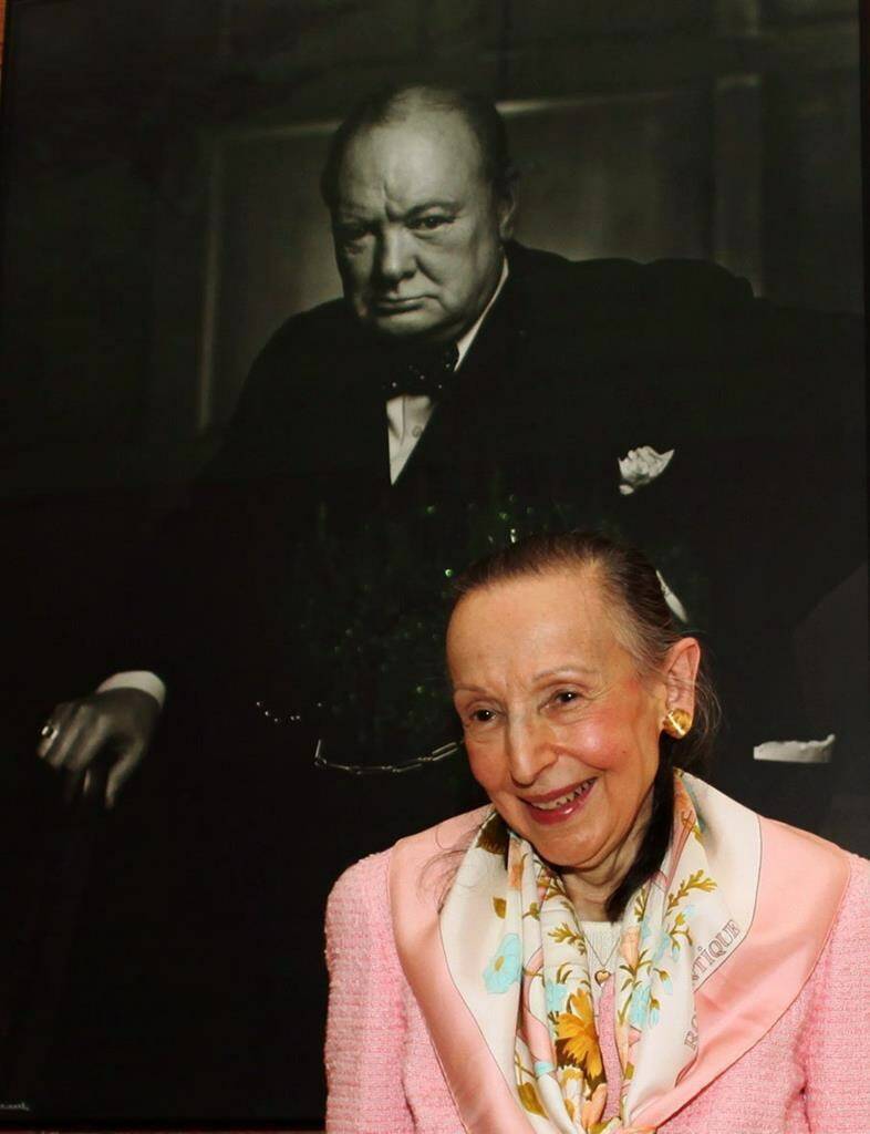 Estrellita Karsh wife of legendary photographer Yousuf Karsh stands in front of the iconic 1941 photograph of Winston Churchill taken by her husband in the Speaker of the House of Commons’ chambers on Tuesday July 14, 2009. THE CANADIAN PRESS/Fred Chartrand