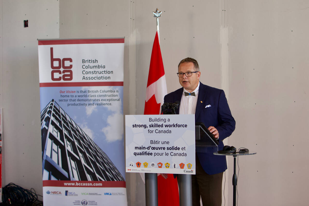 Chris Atchison, president of the British Columbia Construction Association, speaks at a funding announcement for $21 million from the federal government to increase the number of trades apprentices in the province. (Justin Samanski-Langille/News Staff)