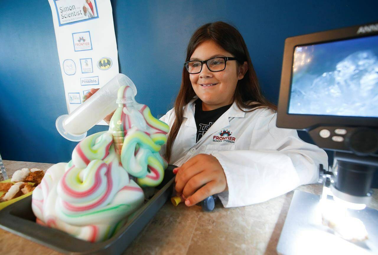 Simon Monteith, a.ka. Simon The Scientist, prepares the “Elephant Toothpaste” experiment in his dining room in Winnipeg, Tuesday, Feb. 23, 2022. In this exciting experiment Monteith combines hydrogen peroxide and yeast and observes the results. Monteith is an award-winning social media personality who uses science to reach children his age and also children from the indigenous community. THE CANADIAN PRESS/John Woods